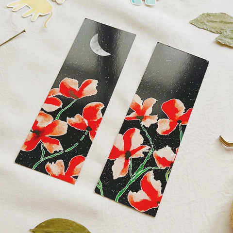 "Dark theme botanical bookmark with vivid red flowers and stars"