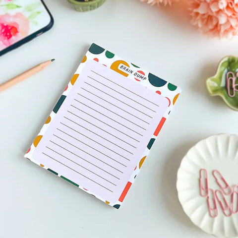 Flat lay of a brain dump notepad for daily mental clarity and organization