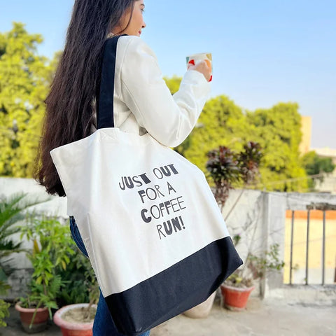 White cotton tote bag featuring bold “Coffee Run” text, great for caffeine lovers