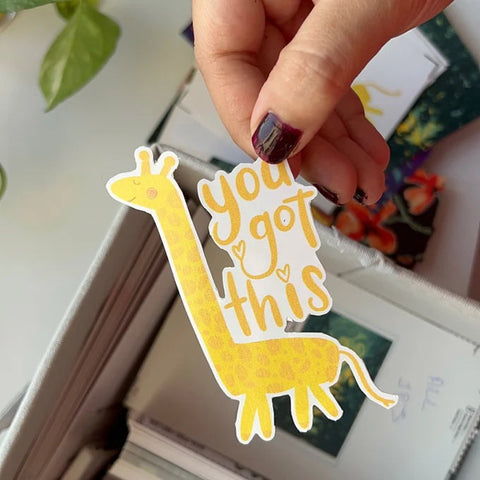 "Cute animal motivational stickers on laptop with penguin, giraffe, and elephant"
