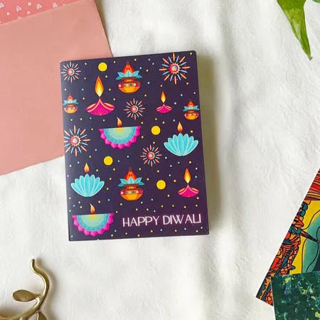 Happy Diwali card featuring traditional oil lamps and modern colors.