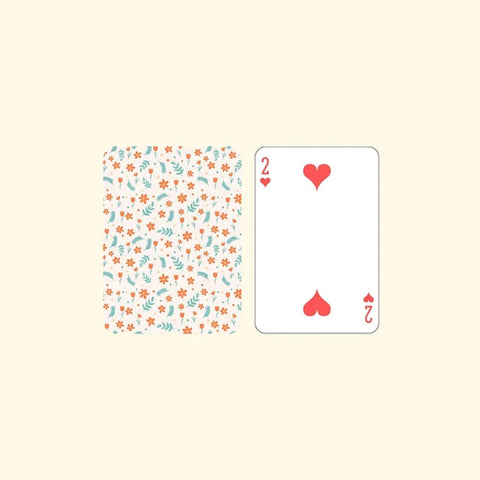 "Elegant flower-themed playing cards with soft pastel colors"