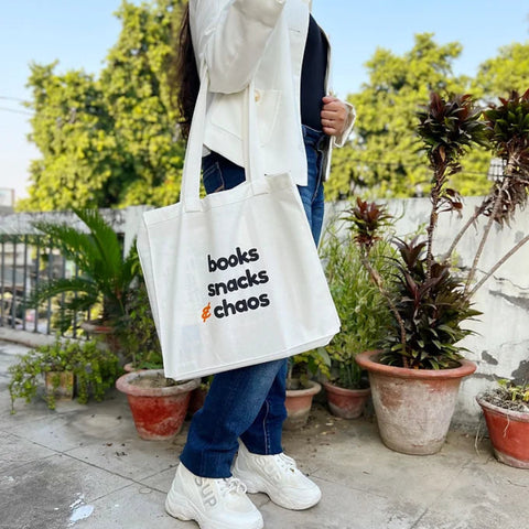 Eco-friendly tote bag for book lovers with quirky text design.