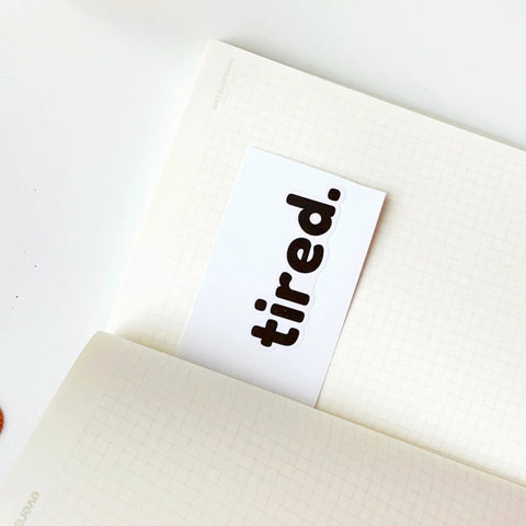 Minimalist tired word sticker for laptops, planners, and journals
