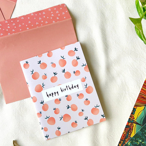 "Illustrated orange-themed birthday card with playful fruit design"