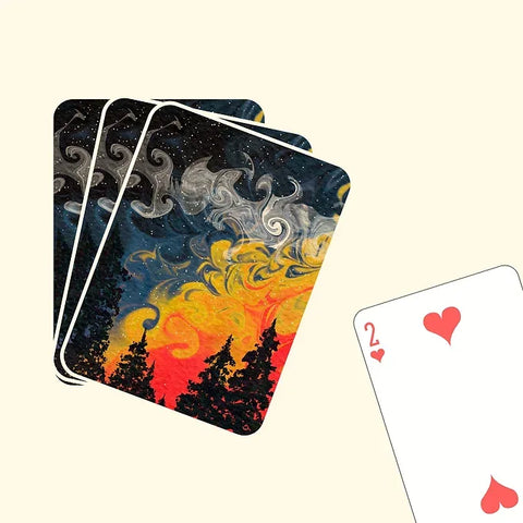 Night sky and forest silhouette design on a unique playing card.