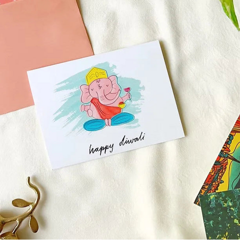 Vibrant Ganesh greeting card with traditional motifs, used during Diwali.

